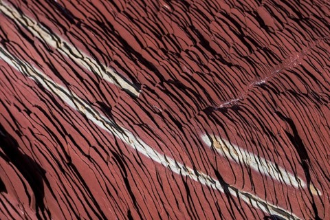 Limestone coloured red by iron and whitish-yellow dolomite