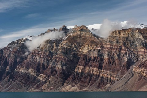 Unfolded coloured rock strata