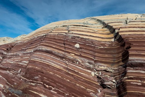 Limestone coloured red by iron and whitish-yellow dolomite