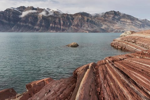 Unfolded coloured rock strata