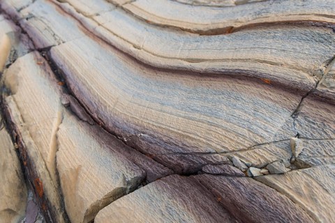 Limestone coloured red by iron and whitish-yellow dolomite