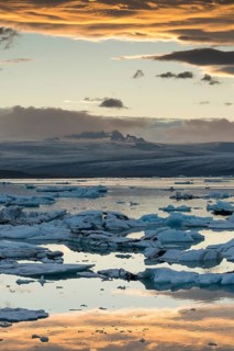 Small icebergs in the glacier lagoon Jokulsarlon at sunset