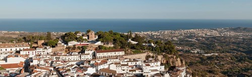 Panoramic view of village and coastal resort of Mijas