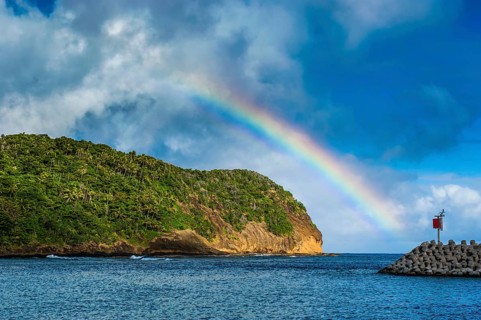 Rainbow above an islet off Ofu Island
