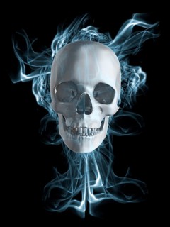 Human skull surrounded by smoke