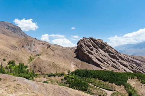 Steep towering rock and ruins of Alamut mountain fortress