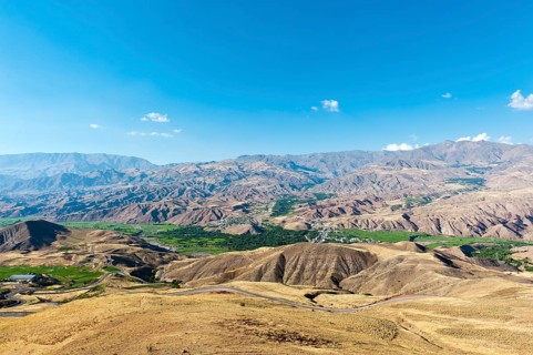 View over Rajaei Dasht village in green valley