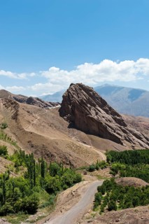 Steep towering rock and ruins of Alamut mountain fortress