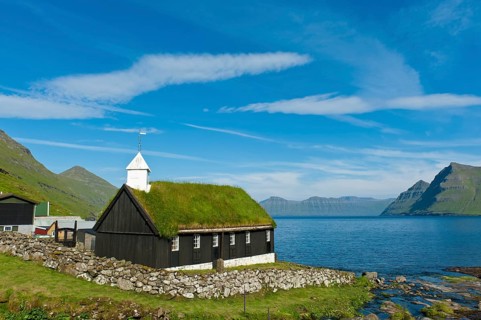 Old Faroese wooden church with a grass roof
