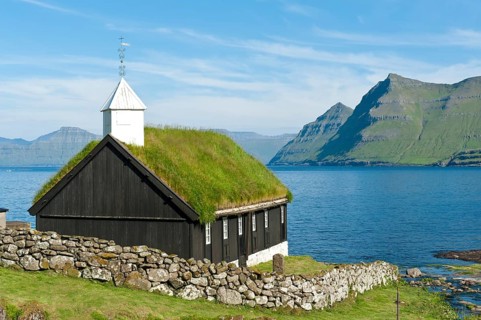 Old Faroese wooden church with a grass roof