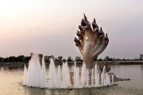 Seven-headed Naga serpent and fountain in front of the Elephant Temple Thep Wittayakhom Vihara