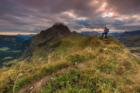 Climber looking on the summit of the Widderstein