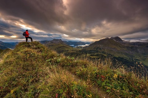 Climber looking on the summit of the Widderstein