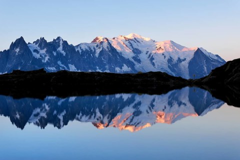 Mont Blanc massif at sunrise reflected in Lac de Chesserys