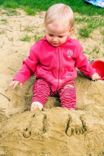 Toddler playing in the sand