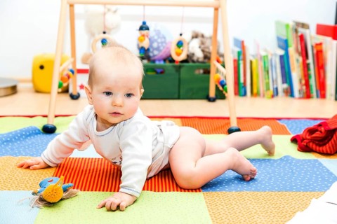 Baby first crawling attempts