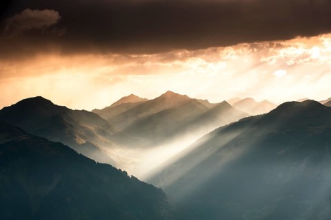 Landscape with sunbeams on the Diedamskopf with view towards Kanisfluh and Damuls