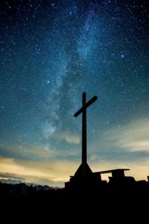 Summit cross at night on the Diedamskopf