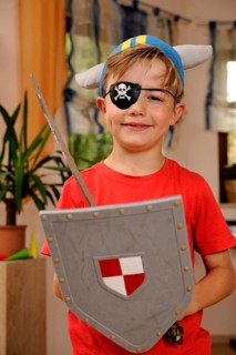 Boy dressed as viking with pirate's eye patch