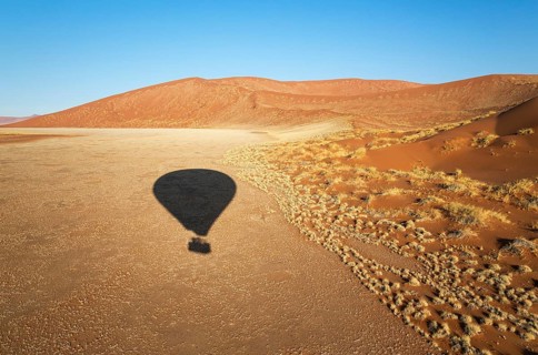 Shadow of a hot-air balloon in the Namib Desert