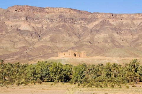 View of Tamnougalt Kasbah with the Djebel Kissane mountain ridge in the back