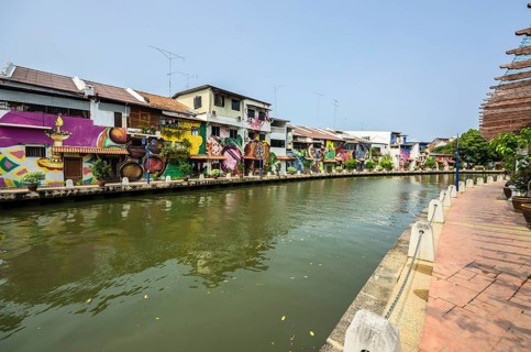 Brightly painted houses along the Malacca River