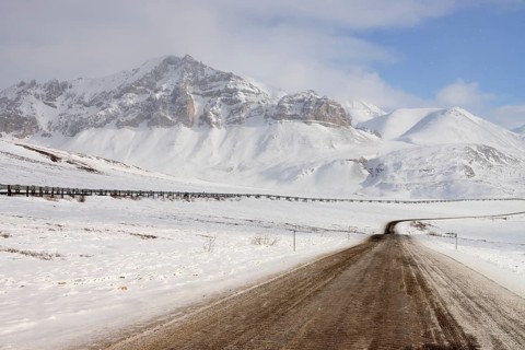 Oil pipeline from Prudhoe Bay to Valdez in the Arctic winter along the Dalton Highway