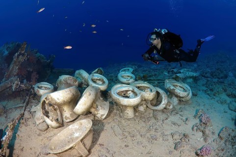 Diver looking at the plumbing on the shipwrecks in Ras Muhammad National Park