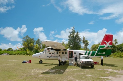 A small plane of Seychelles airlines on the runway