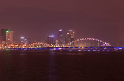 Illuminated Cáº§u Rá»“ng or dragon bridge over the Han River at night