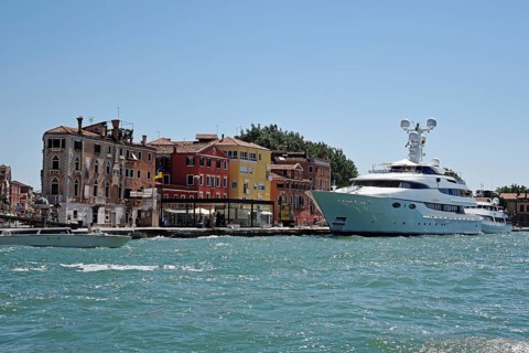 Large yacht in front of houses by San Marco basin