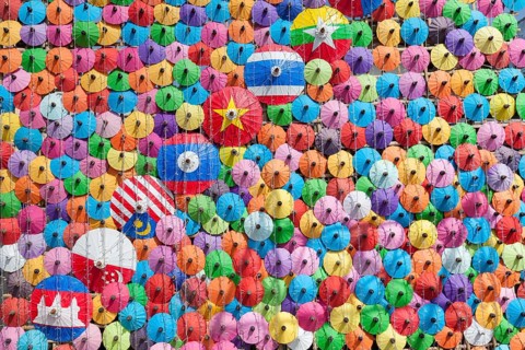 Many colourful umbrellas suspended in mid-air