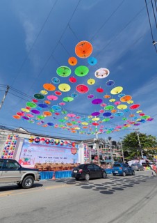 Many colourful umbrellas suspended in mid-air