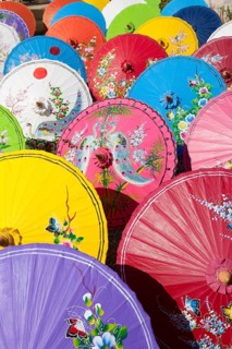Handmade paper parasols drying in the sun at an umbrella factory in Bo Sang