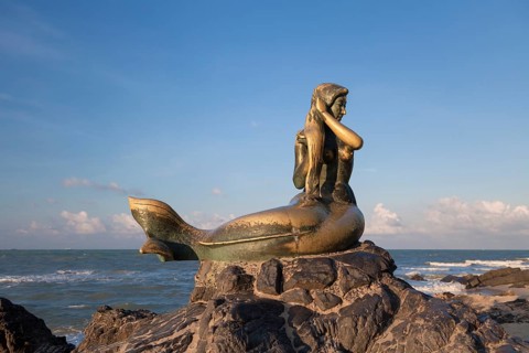 Golden mermaid statue on Samila beach