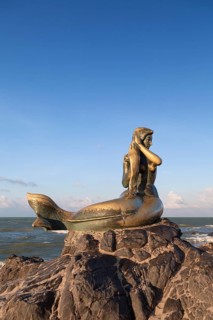 Golden mermaid statue on Samila beach