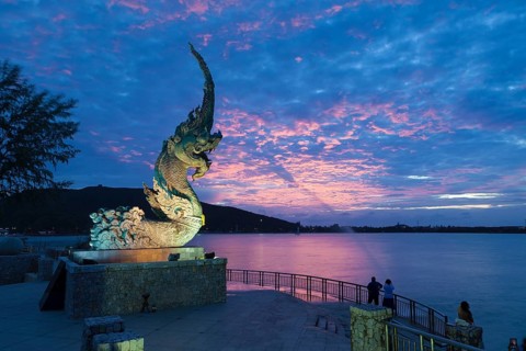 Dragon fountain at dusk on the promenade in Songkhla