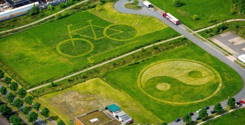 Bicycle and Yin Yang symbol mowed into a meadow