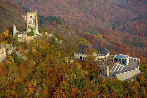 Drachenfels castle ruins with plateau and glass cube in the fall