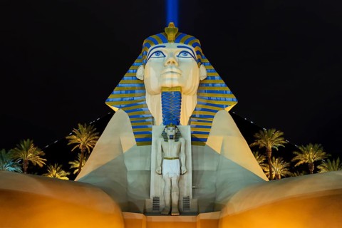 Sphinx pyramid and palms