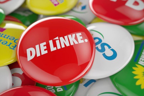 German political party Die Linke button in front between other governing party buttons