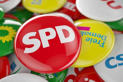 German political party SPD button in front between other governing party buttons