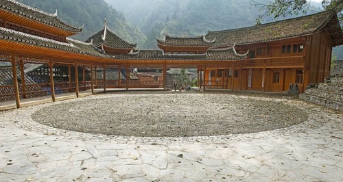 Traditional pagodas line the meeting place in the Miao village of Langde