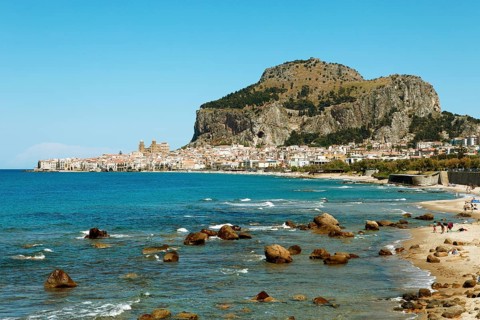 Beach and limestone cliff Rocca di Cefalu