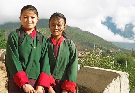 Girls wearing the traditional Kira dress in Paro