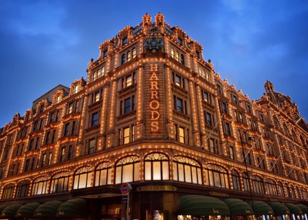 Illuminated Harrods department store in the evening