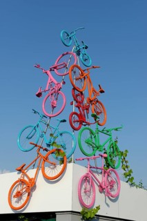 Sculpture with colourful bikes on bike path