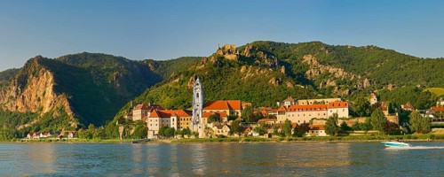 Townscape with collegiate church and castle ruins