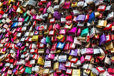 Many colourful love padlocks at the wall of Juliet's house
