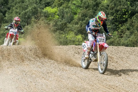 Two motorcyclists on motocross bikes